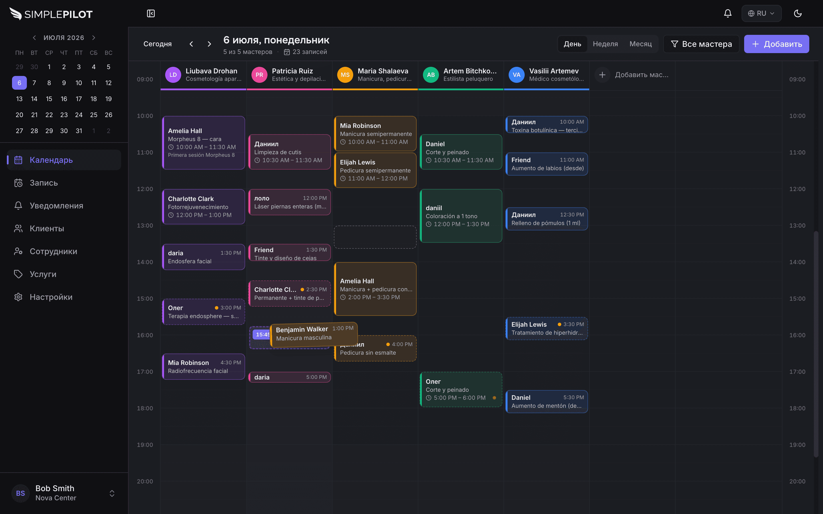 SimplePilot — day calendar with staff columns (dark)